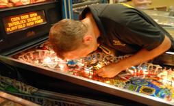 Repairing a competition machine at the UK Pinball Show